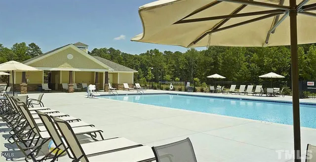 a view of a swimming pool with a patio