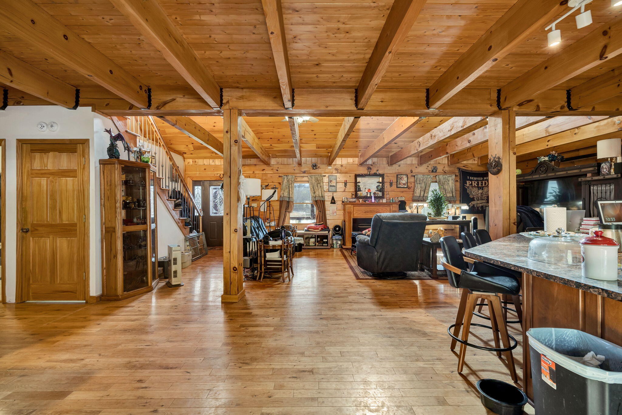 180 McJunkin Road Tellico Plains, TN 37385 - Photo 12 of 60 a living room with lots of furniture and a kitchen view