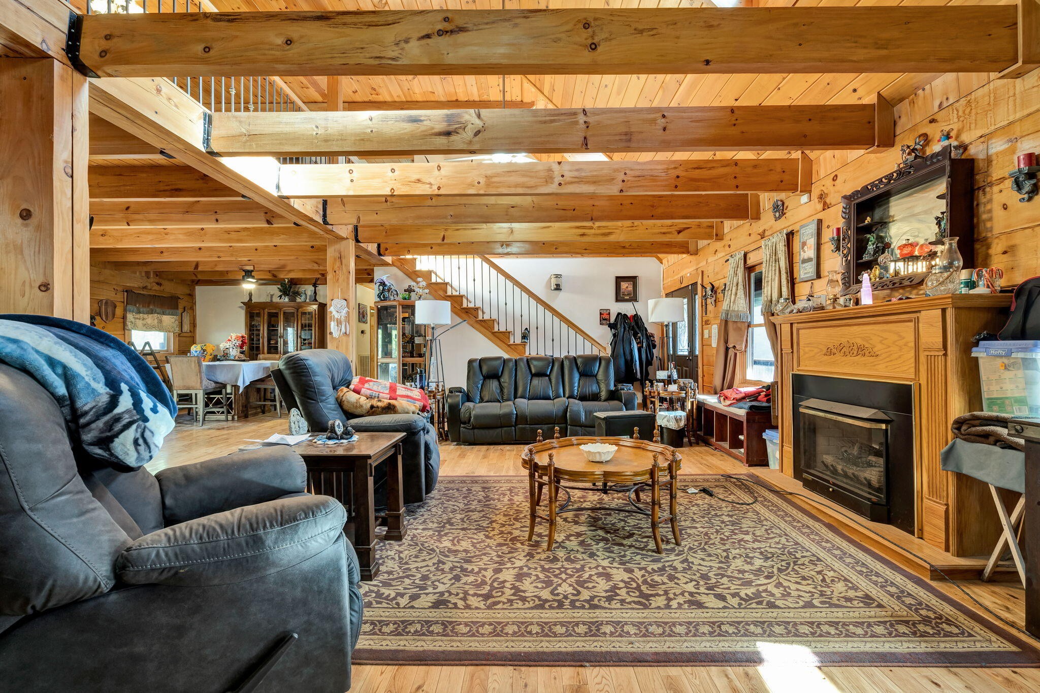 180 McJunkin Road Tellico Plains, TN 37385 - Photo 16 of 60 a living room with furniture and a fireplace