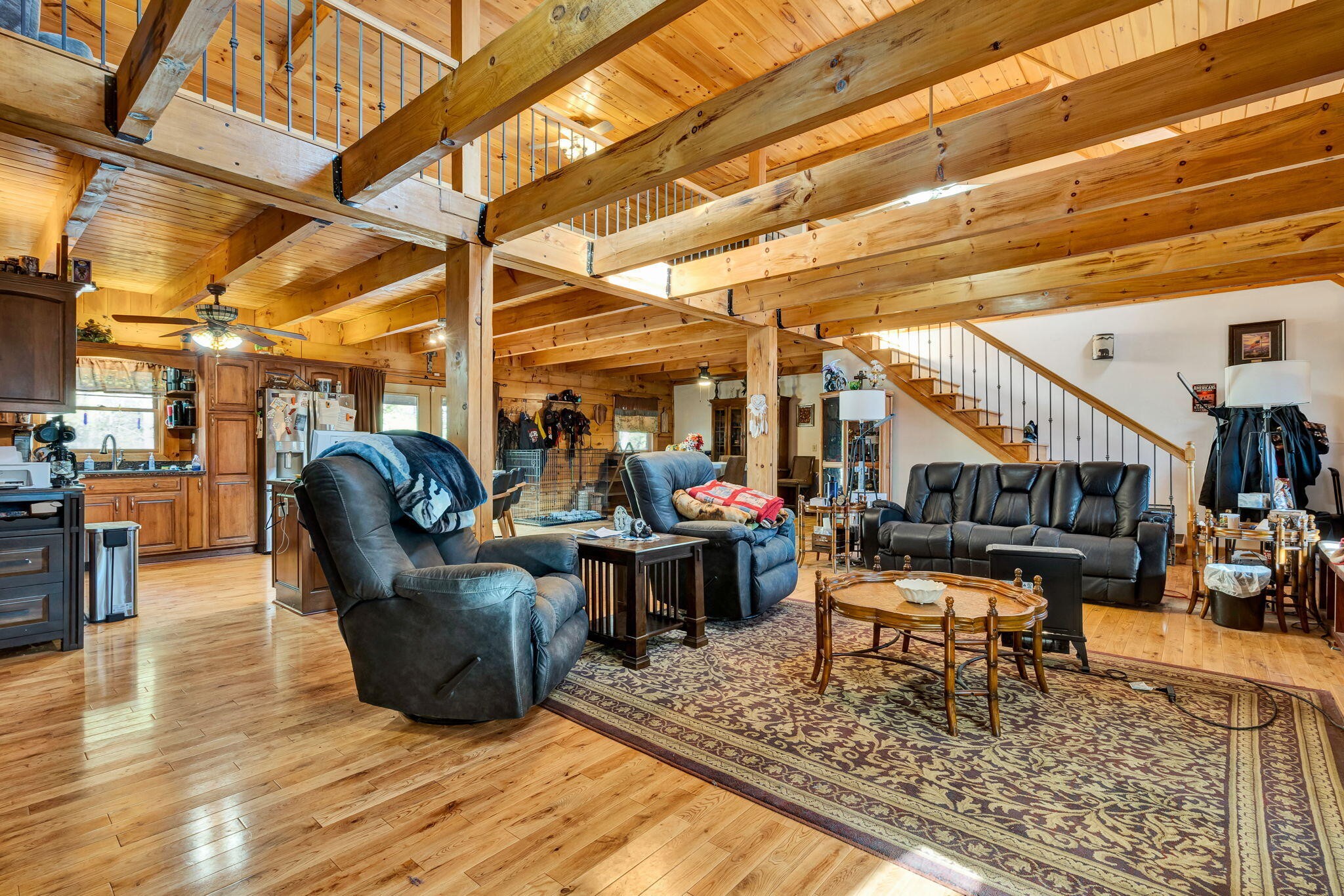 180 McJunkin Road Tellico Plains, TN 37385 - Photo 17 of 60 a living room with furniture a rug and a table