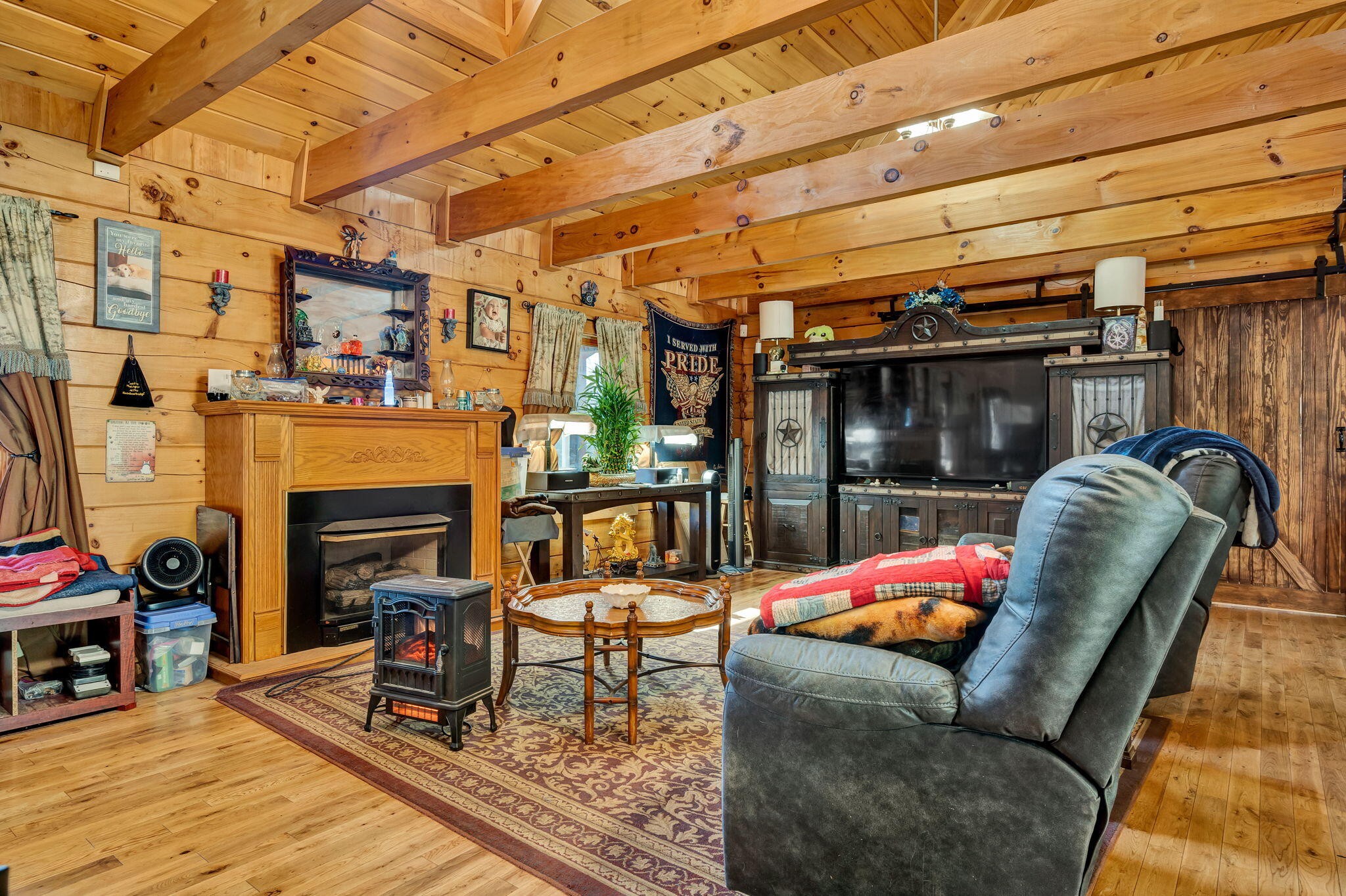 180 McJunkin Road Tellico Plains, TN 37385 - Photo 19 of 60 a outdoor space with patio furniture and a fireplace