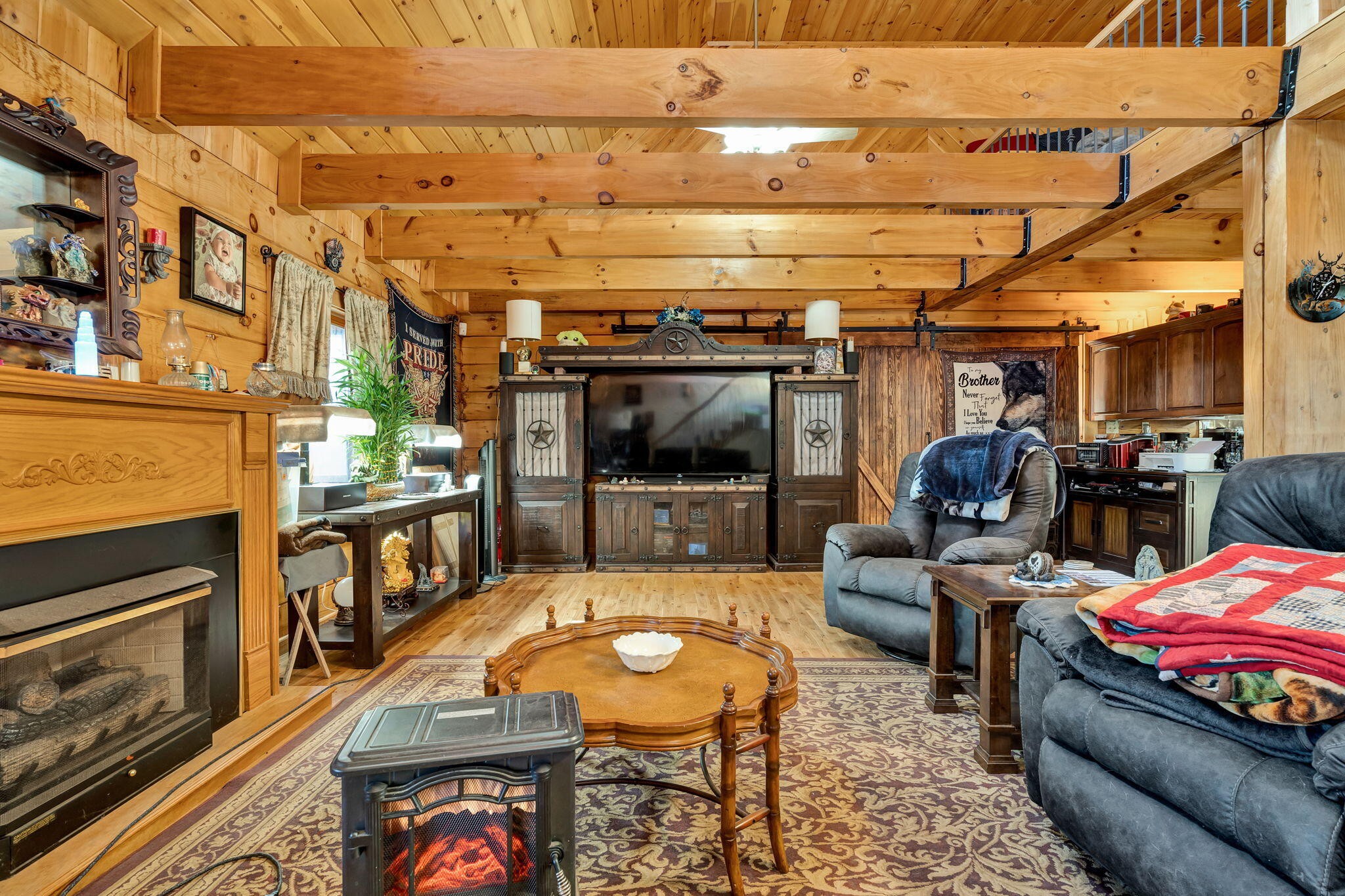 180 McJunkin Road Tellico Plains, TN 37385 - Photo 20 of 60 a living room with furniture and a flat screen tv
