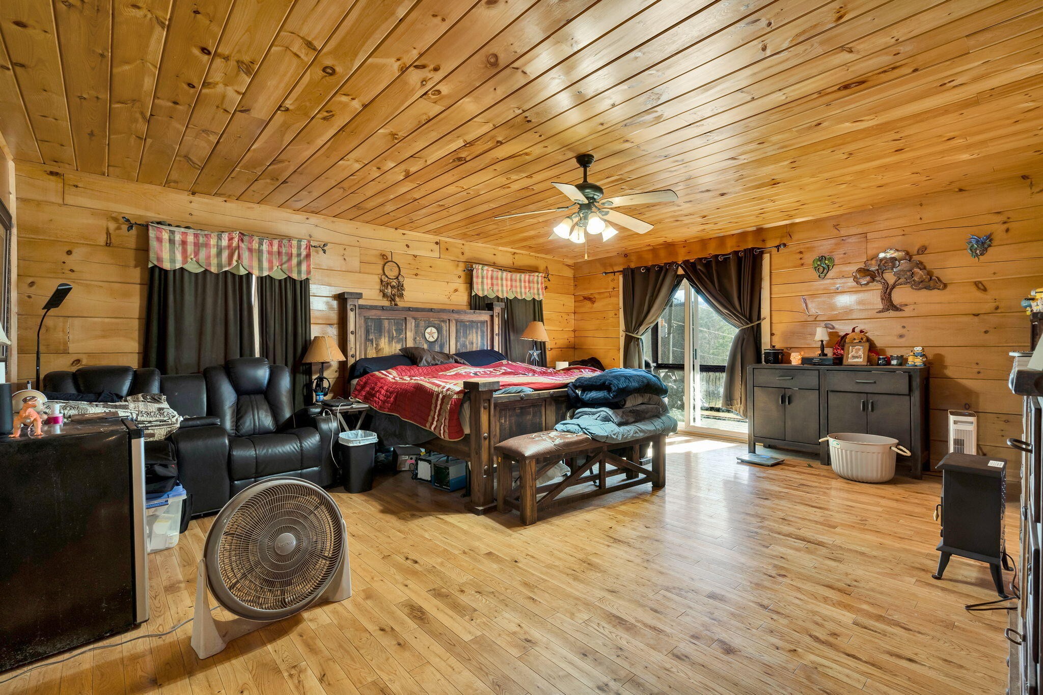 180 McJunkin Road Tellico Plains, TN 37385 - Photo 27 of 60 a bedroom with furniture and a chandelier