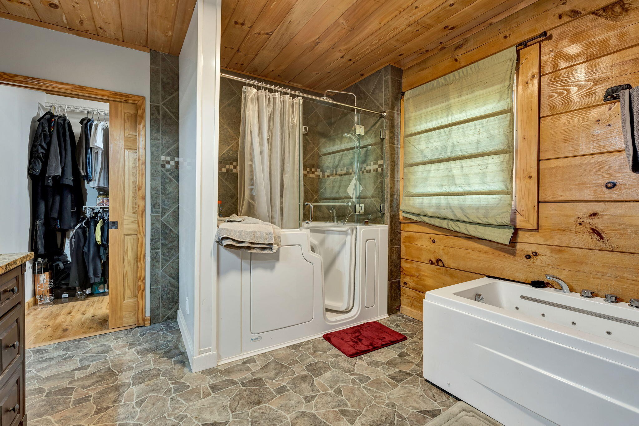 180 McJunkin Road Tellico Plains, TN 37385 - Photo 29 of 60 a bathroom with a tub and shower