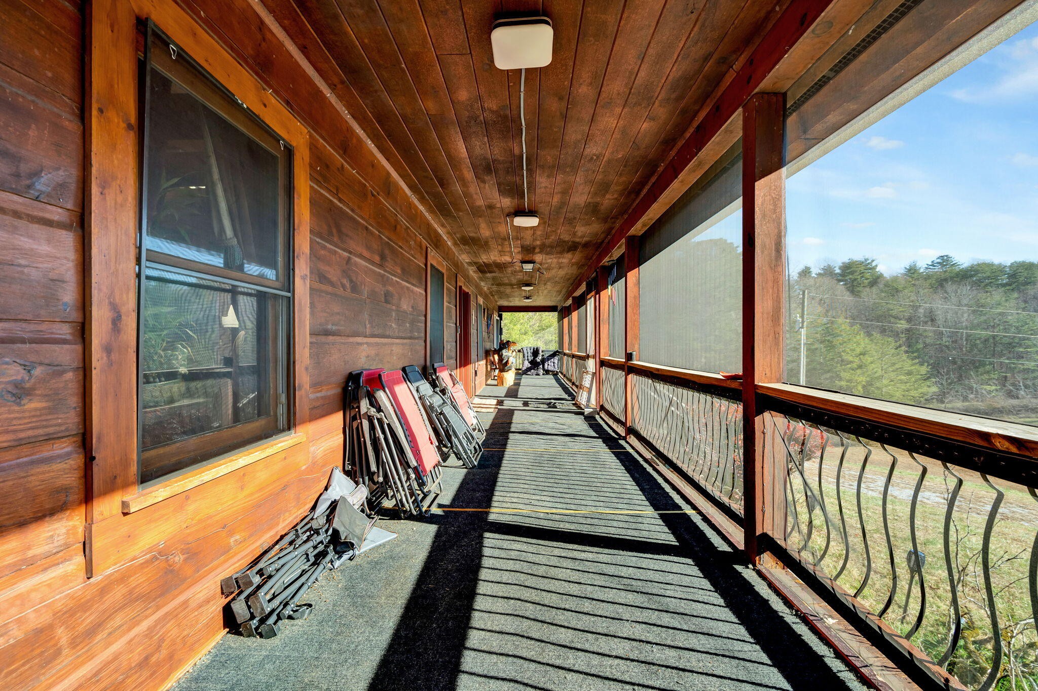 180 McJunkin Road Tellico Plains, TN 37385 - Photo 3 of 60 a view of outdoor space with wooden floor and iron stairs