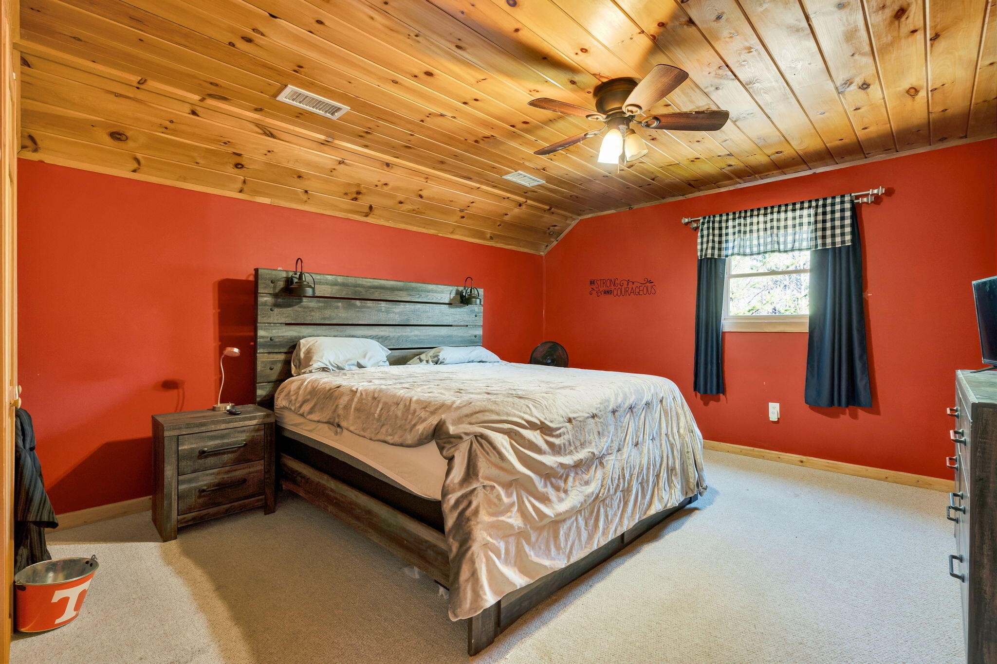 180 McJunkin Road Tellico Plains, TN 37385 - Photo 39 of 60 a bed sitting in a spacious bedroom next to a window