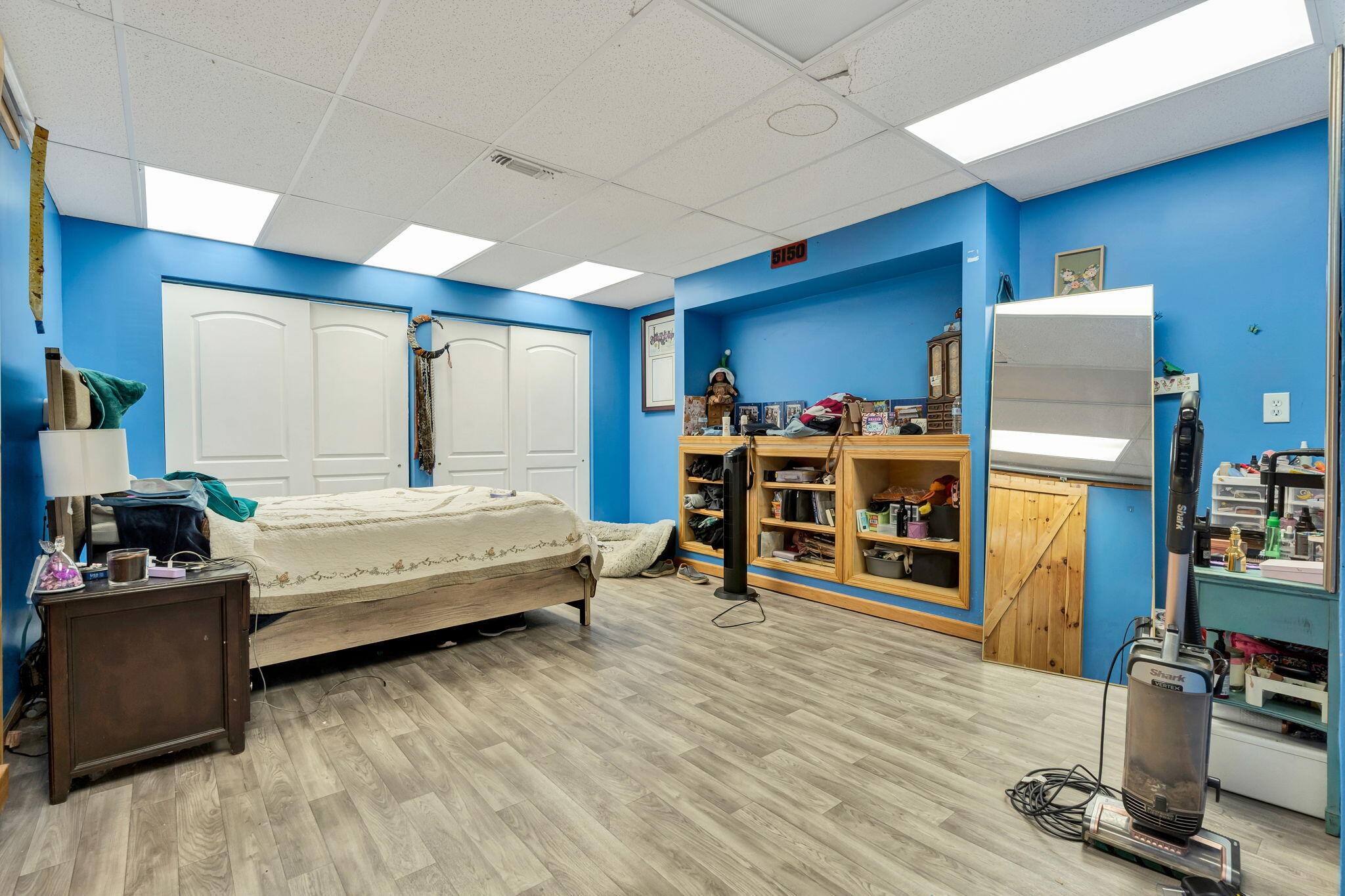 180 McJunkin Road Tellico Plains, TN 37385 - Photo 44 of 60 a bedroom with furniture and a wooden floor