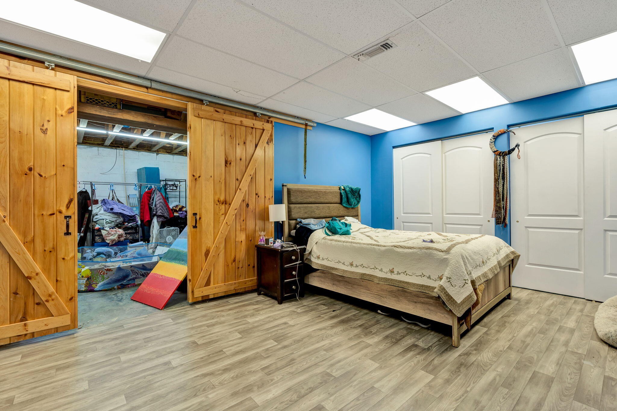 180 McJunkin Road Tellico Plains, TN 37385 - Photo 47 of 60 a bedroom with a bed closet and a large window