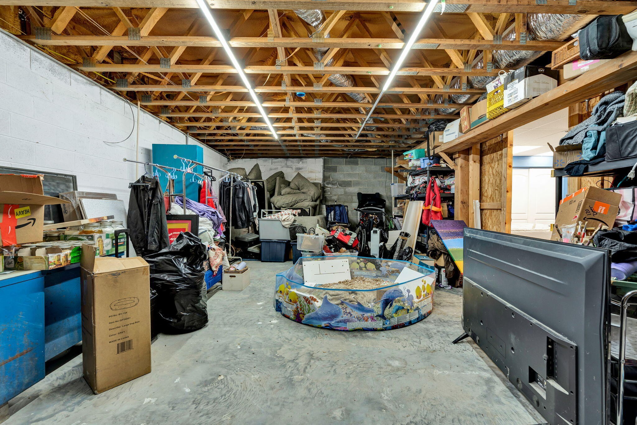 180 McJunkin Road Tellico Plains, TN 37385 - Photo 48 of 60 a view of a storage room with a lot of stuff
