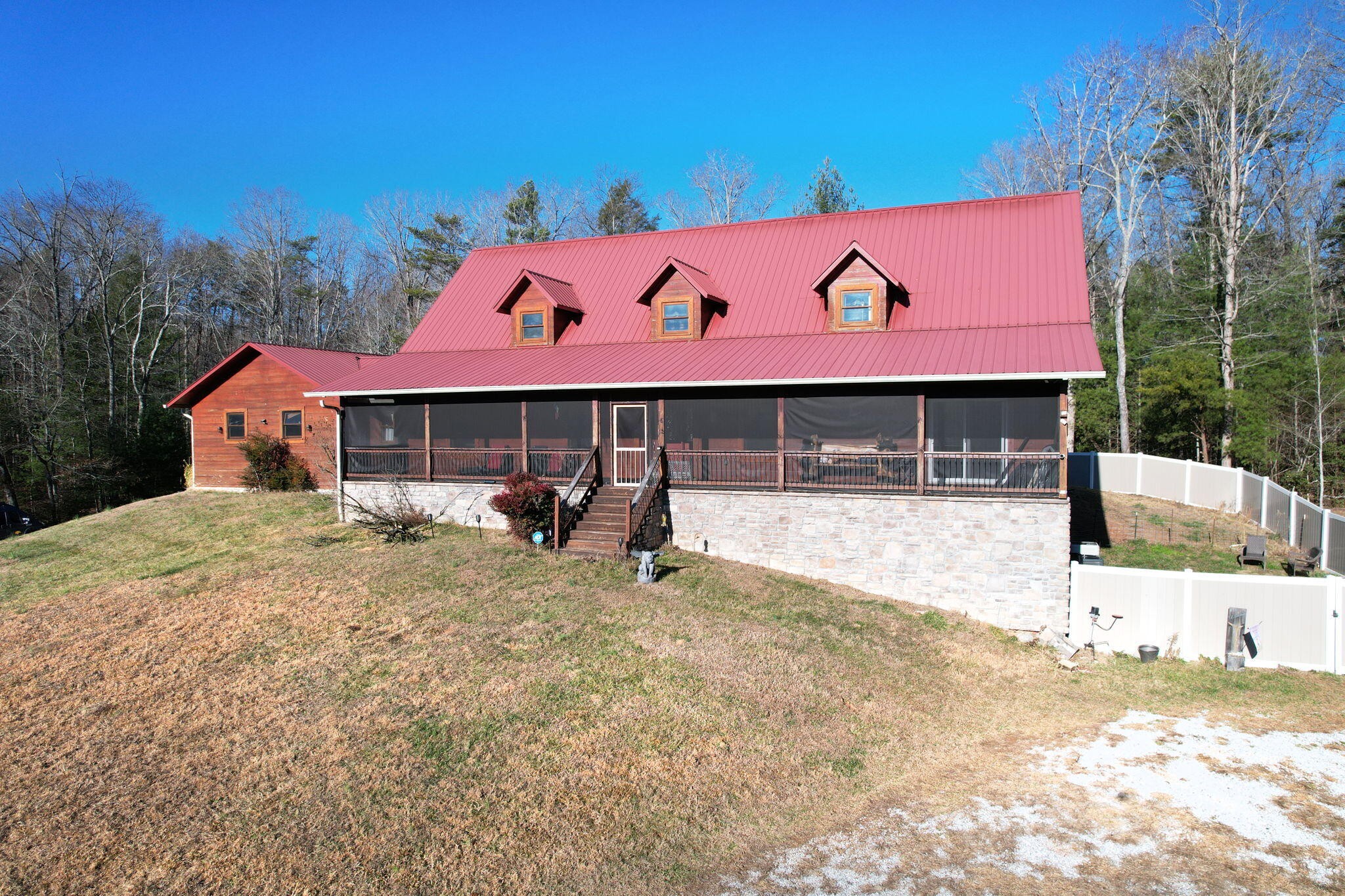 180 McJunkin Road Tellico Plains, TN 37385 - Photo 51 of 60 a front view of a house with a yard
