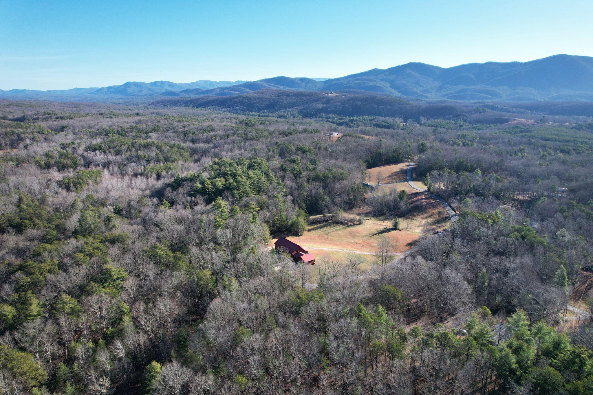 180 McJunkin Road Tellico Plains, TN 37385 - Photo 60 of 60 a view of a lush green hillside and a houses