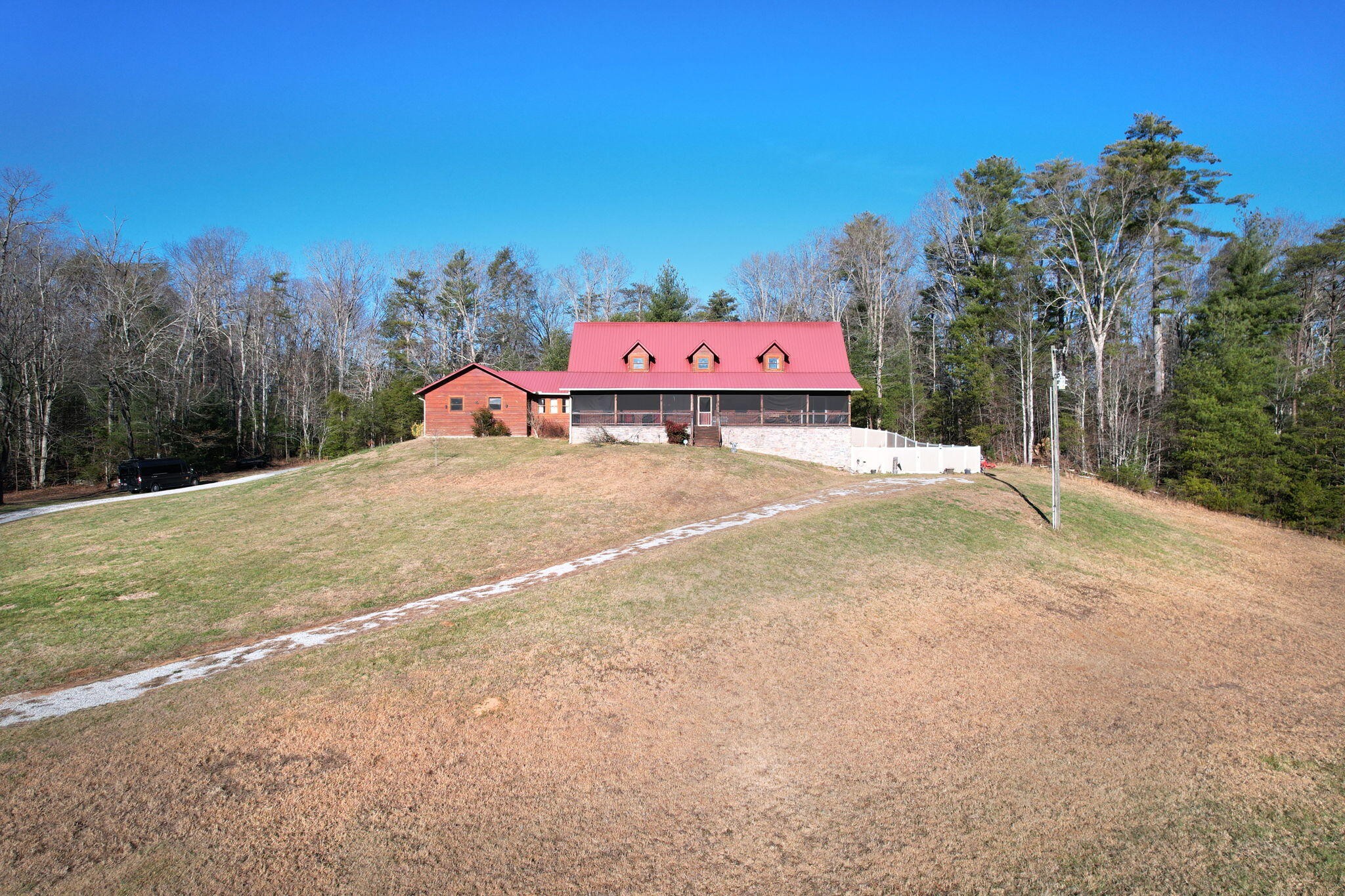 180 McJunkin Road Tellico Plains, TN 37385 - Photo 6 of 60 a wooden fence with some trees in the background