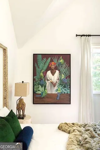 a bathroom with a shower and mirror