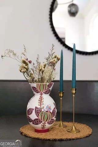 a dining room with chandelier and windows