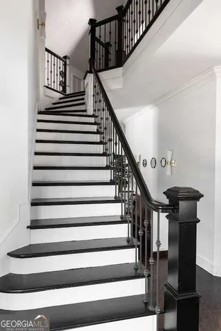 a bedroom with a bed and a potted plant
