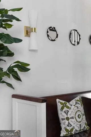a kitchen with a table chairs sink and cabinets