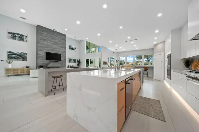 a spacious bathroom with a double vanity sink a mirror and a bathtub