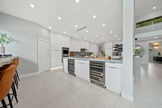 a en suite bathroom with a double vanity sink and a mirror