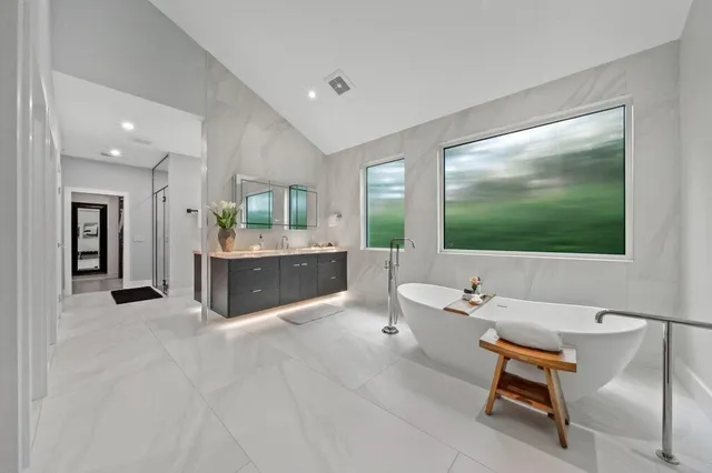 a bathroom with a double vanity sink and a mirror