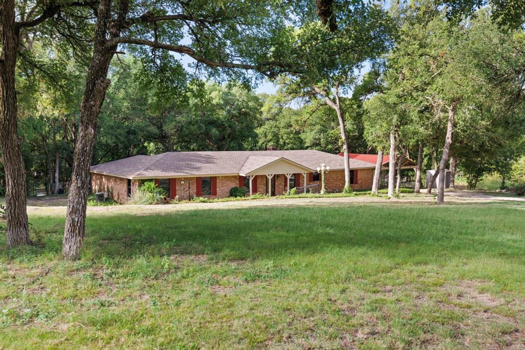 13539 Chapel Road Lorena, TX 76655 - Photo 2 of 37 Expansive front lawn bordered by mature trees
