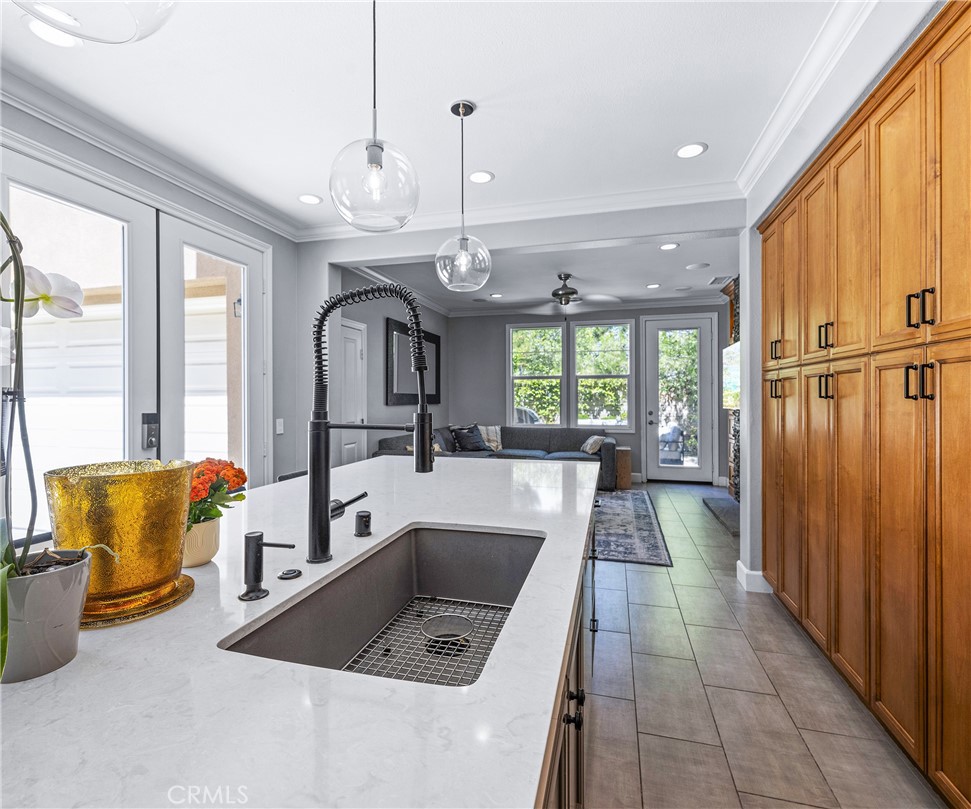 45 Coriander Irvine, CA 92603 - Photo 13 of 64 a view of a kitchen with kitchen island granite countertop living room