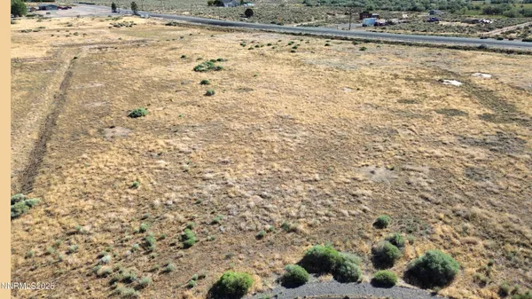 an aerial view of a forest with beach