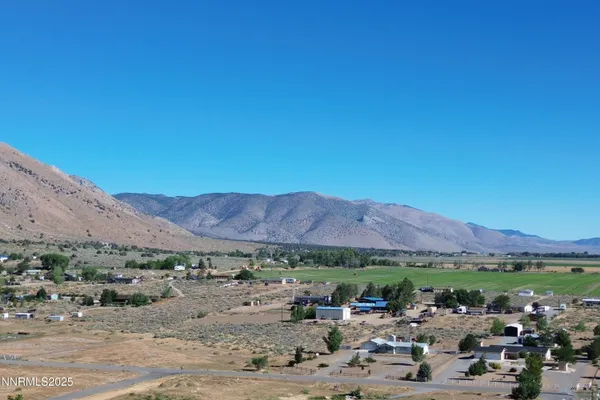 a view of an ocean and a mountain