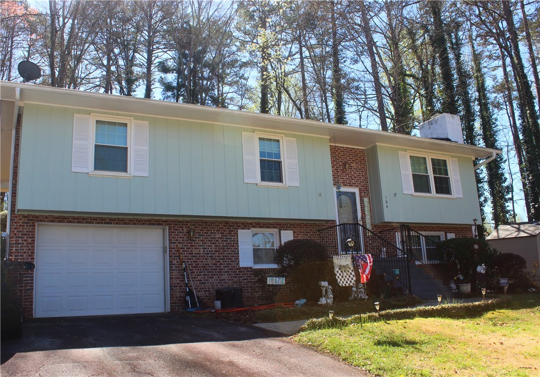 104 Laurel Lane Seneca, SC 29678 - Photo 2 of 34 This classic brick and siding home offers a welcoming facade with an integrated garage.