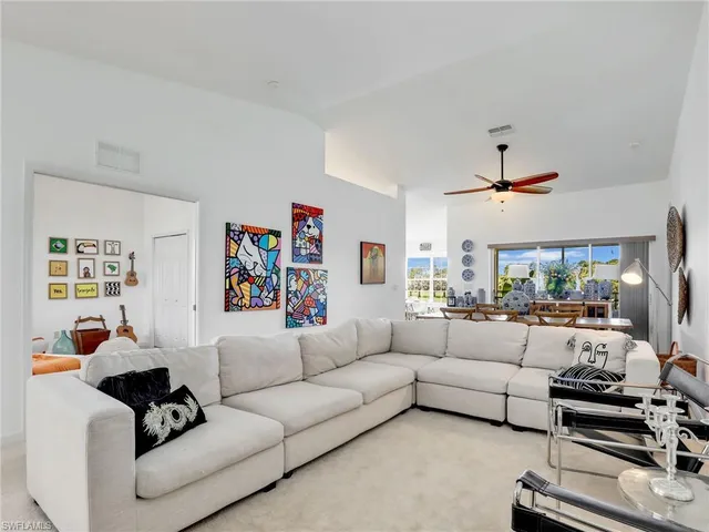 a living room with furniture fireplace and window
