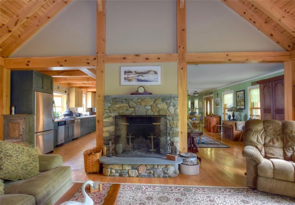 746 Silver Lake Road Bucksport, ME 04416 - Photo 5 of 25 Stone fireplace is a focal point of...