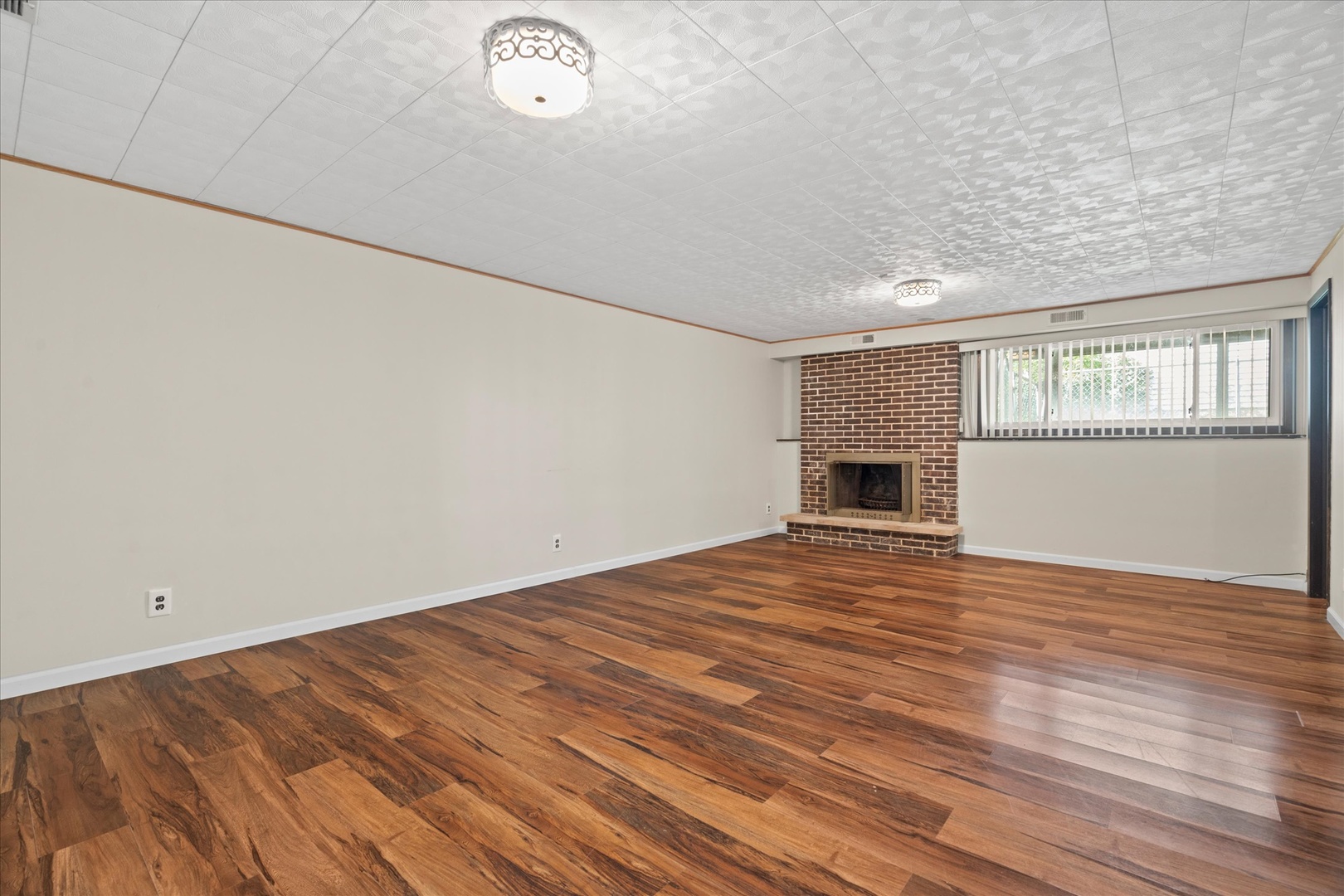 446 Rockhurst Road Bolingbrook, IL 60440 - Photo 18 of 32 an empty room with wooden floor and a window