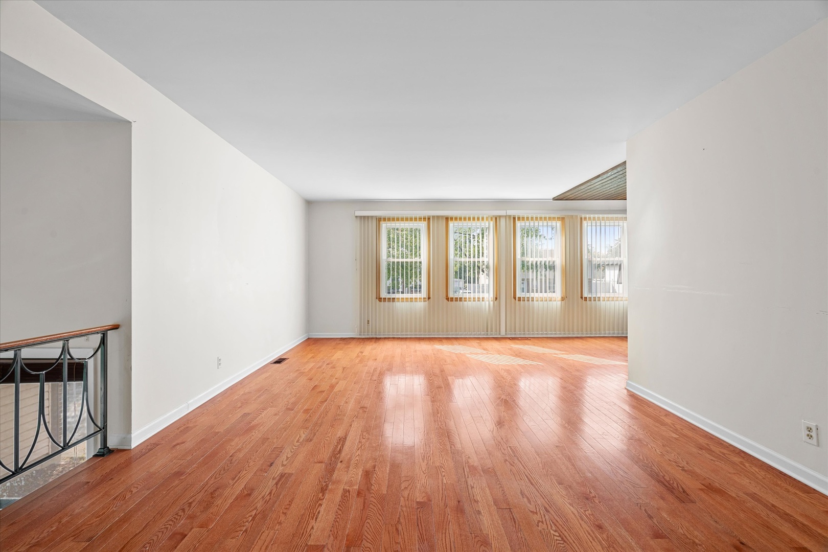 446 Rockhurst Road Bolingbrook, IL 60440 - Photo 3 of 32 wooden floor in an empty room with a window