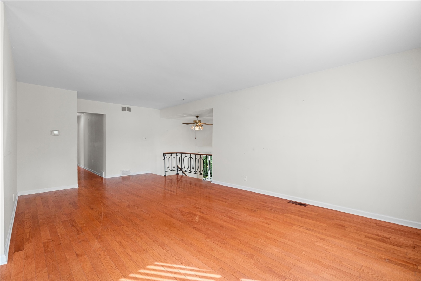 446 Rockhurst Road Bolingbrook, IL 60440 - Photo 10 of 32 a view of a bedroom with a bed and wooden floor