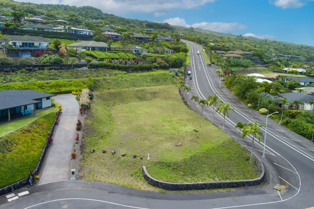 a view of a swimming pool with a yard and mountain view