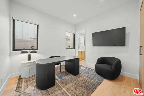 a living room with a couch and a flat screen tv