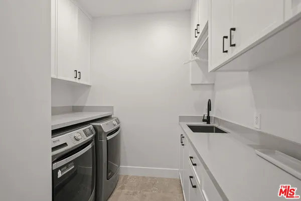 a kitchen with a stove and a sink