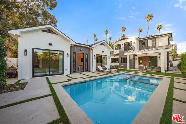 a front view of house with yard outdoor seating and barbeque oven