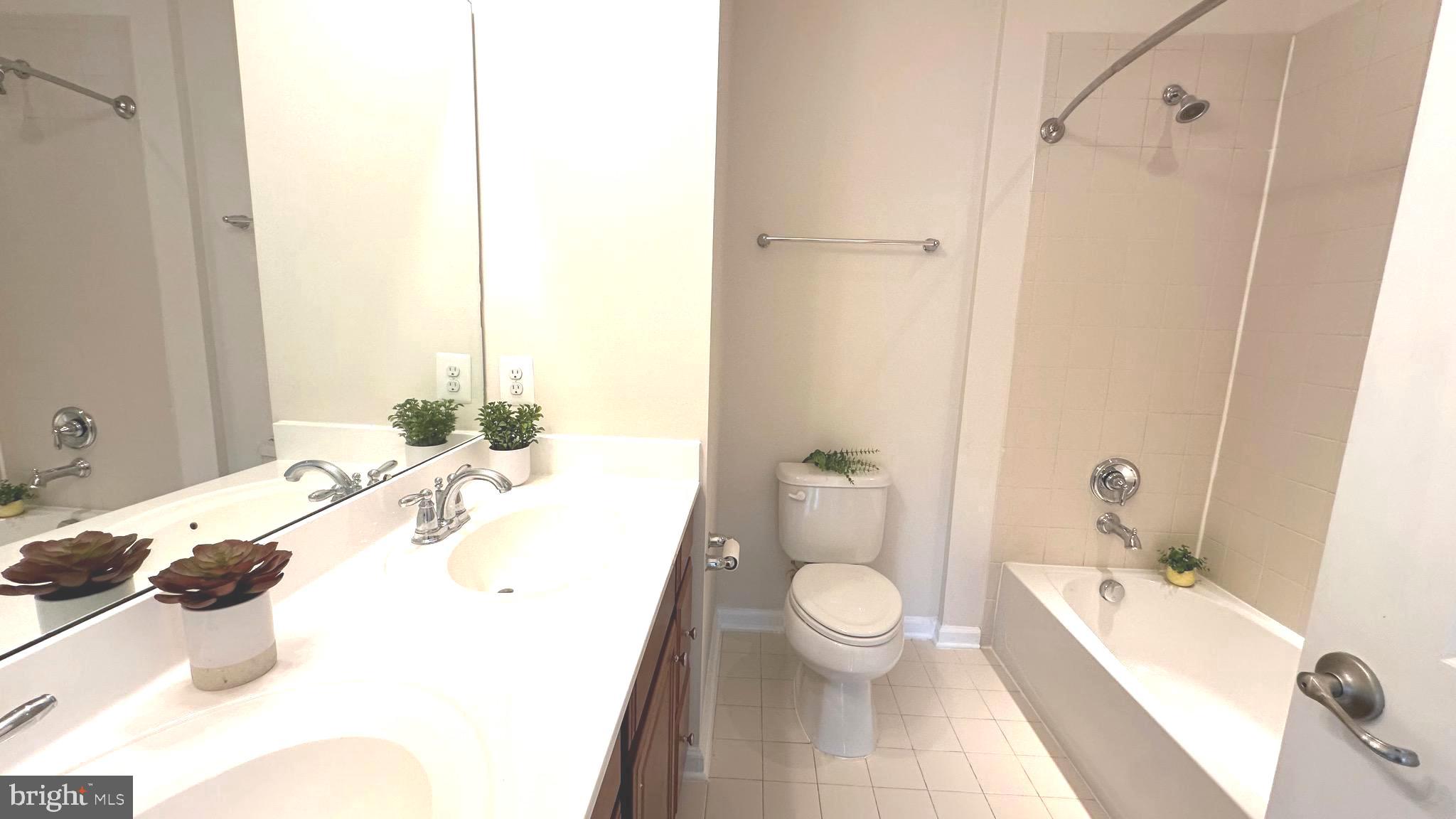 7343 Old Calvary Road Hanover, MD 21076 - Photo 3 of 35 a bathroom with a sink a toilet and shower