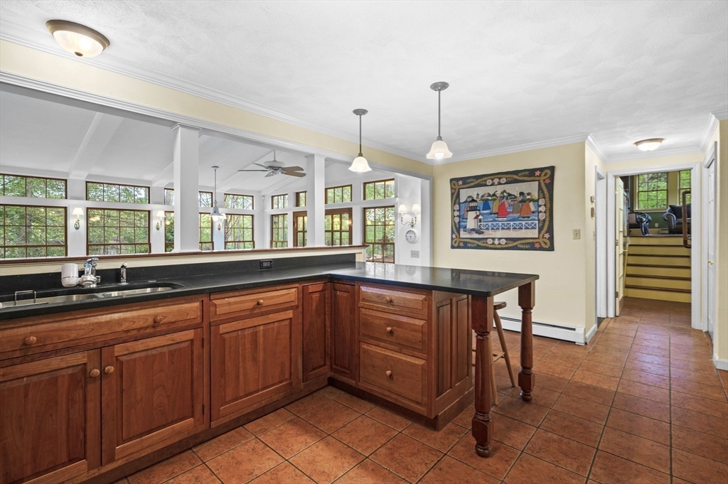 265 B Washington Street Boxford, MA 01921 - Photo 12 of 42 a kitchen with stainless steel appliances granite countertop a stove a sink dishwasher and a wooden cabinets