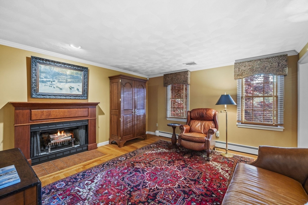 265 B Washington Street Boxford, MA 01921 - Photo 17 of 42 a living room with furniture and a fireplace