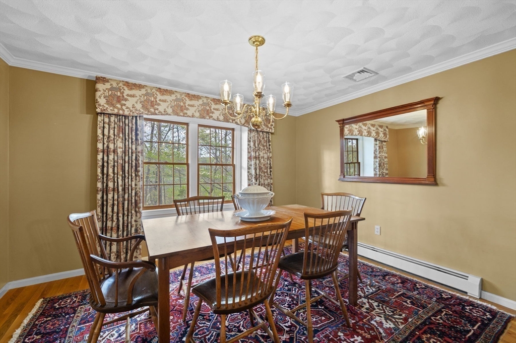 265 B Washington Street Boxford, MA 01921 - Photo 22 of 42 a dining room with furniture a chandelier and window