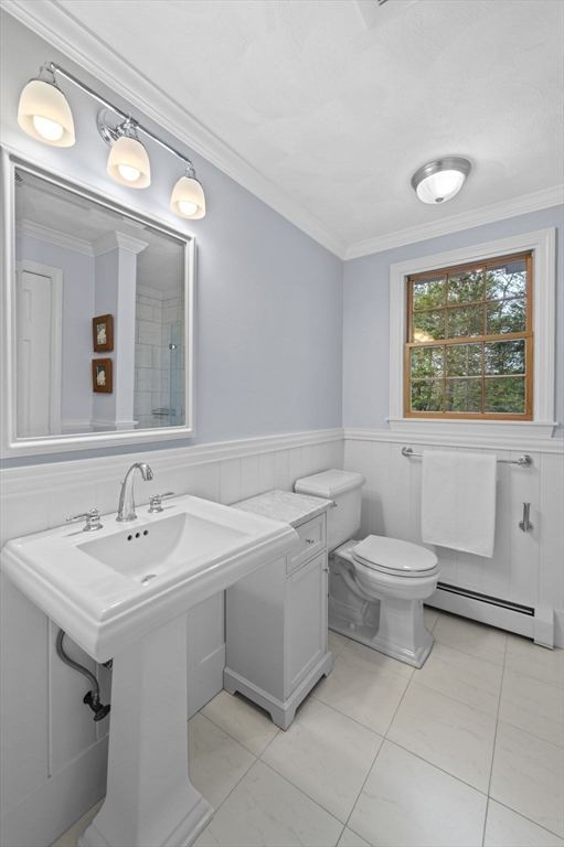 265 B Washington Street Boxford, MA 01921 - Photo 28 of 42 a bathroom with a toilet sink and mirror