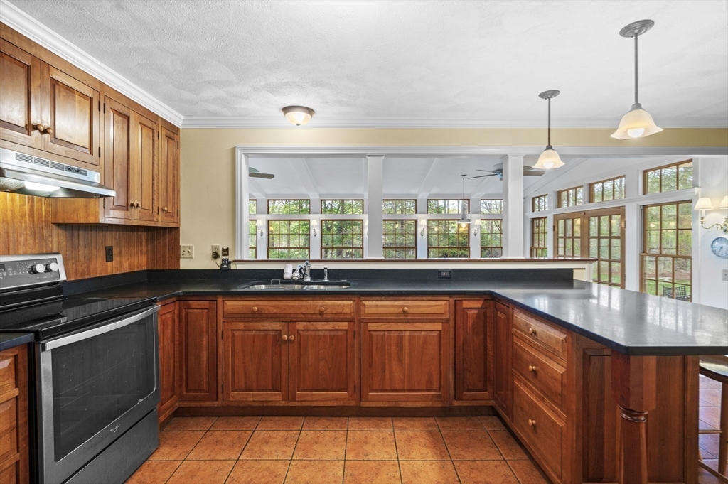 265 B Washington Street Boxford, MA 01921 - Photo 10 of 42 a kitchen with a sink stove and cabinets