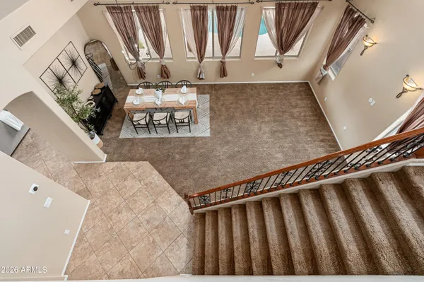 a view of staircase with rug