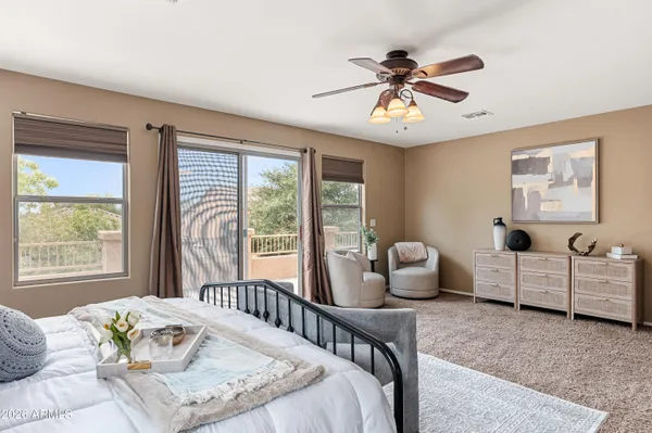 a bedroom with furniture and a window