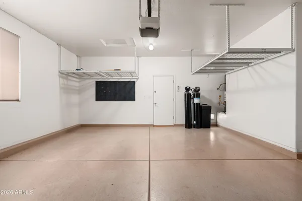 a view of a refrigerator and window in a room