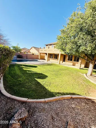 a view of an swimming pool with a yard