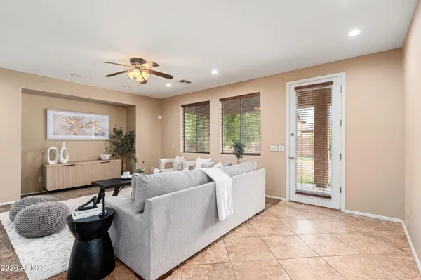 a living room with furniture and a large window