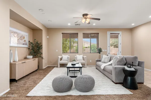 a living room with furniture and a large window