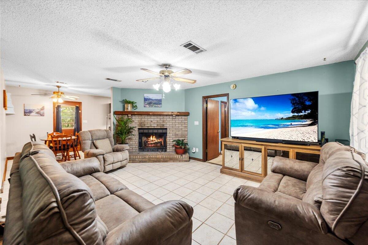 5351 Highway 4 Baker, FL 32531 - Photo 6 of 9 a living room with furniture and a flat screen tv